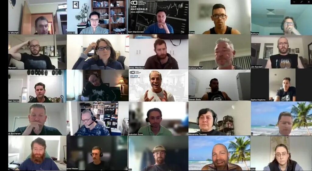 A video call grid filled with dozens of participants